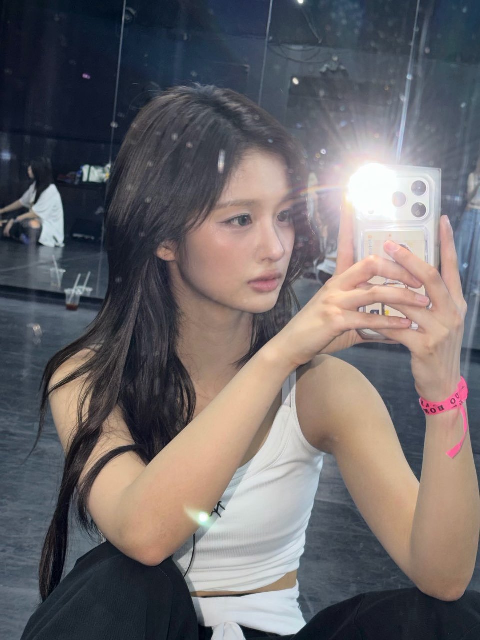 Photo shared by NMIXX 엔믹스 SULLYOON 설윤 on February 19, 2026 tagging @nmixx_official. May be a selfie of one or more people, hair, top, mirror and text.