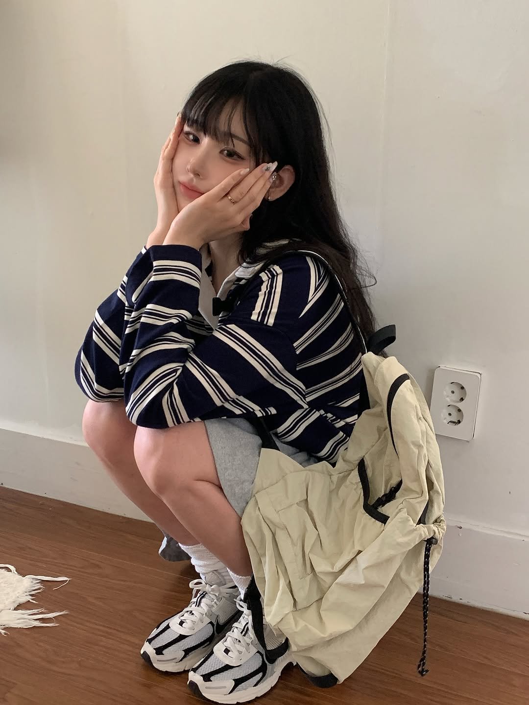 Photo by 남수민 on September 28, 2025. May be an image of 1 person, hair, miniskirt and text.