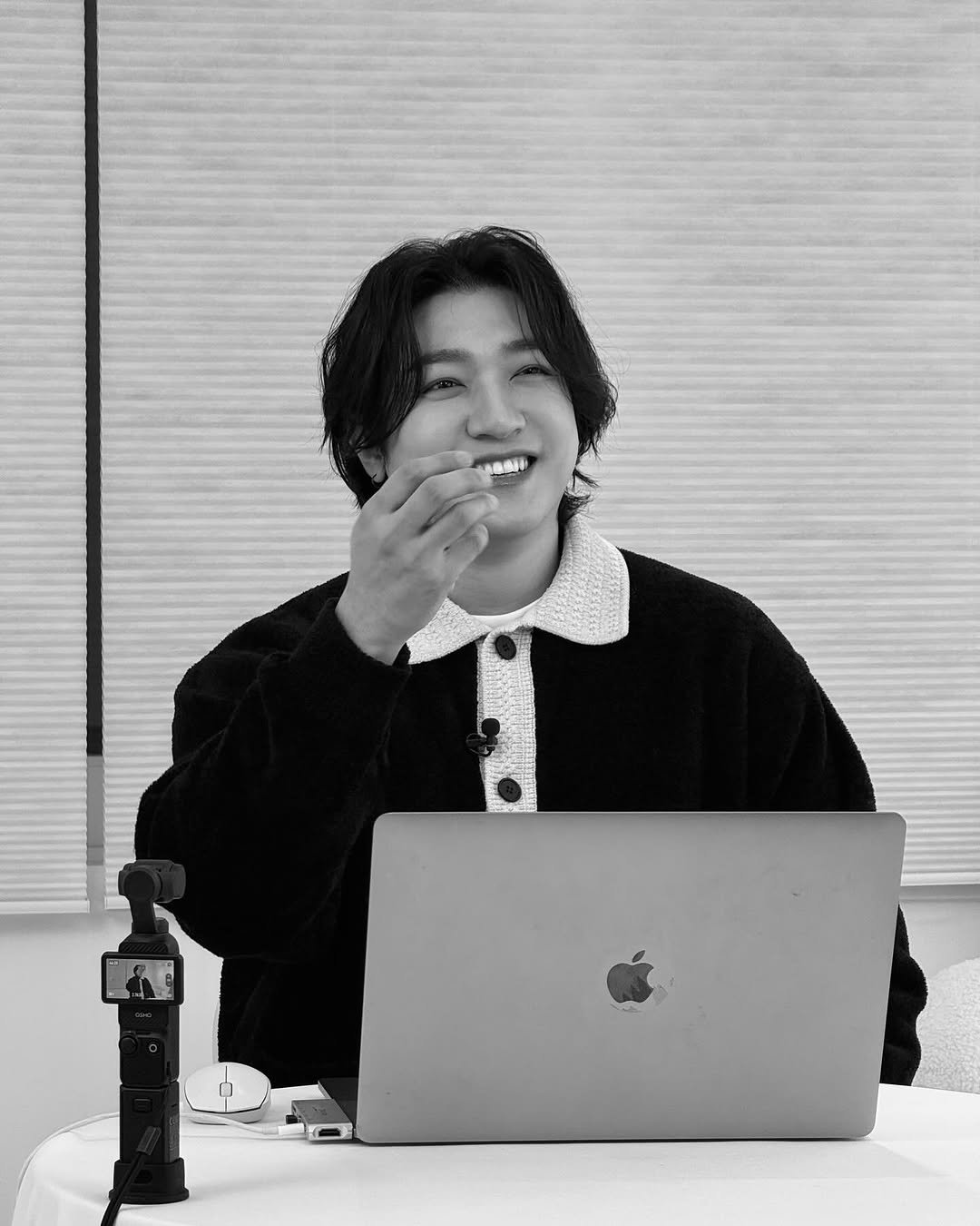 Photo by 박성진 on February 16, 2026. May be a black-and-white image of one or more people, bangs, top, bolo tie, magazine and text.