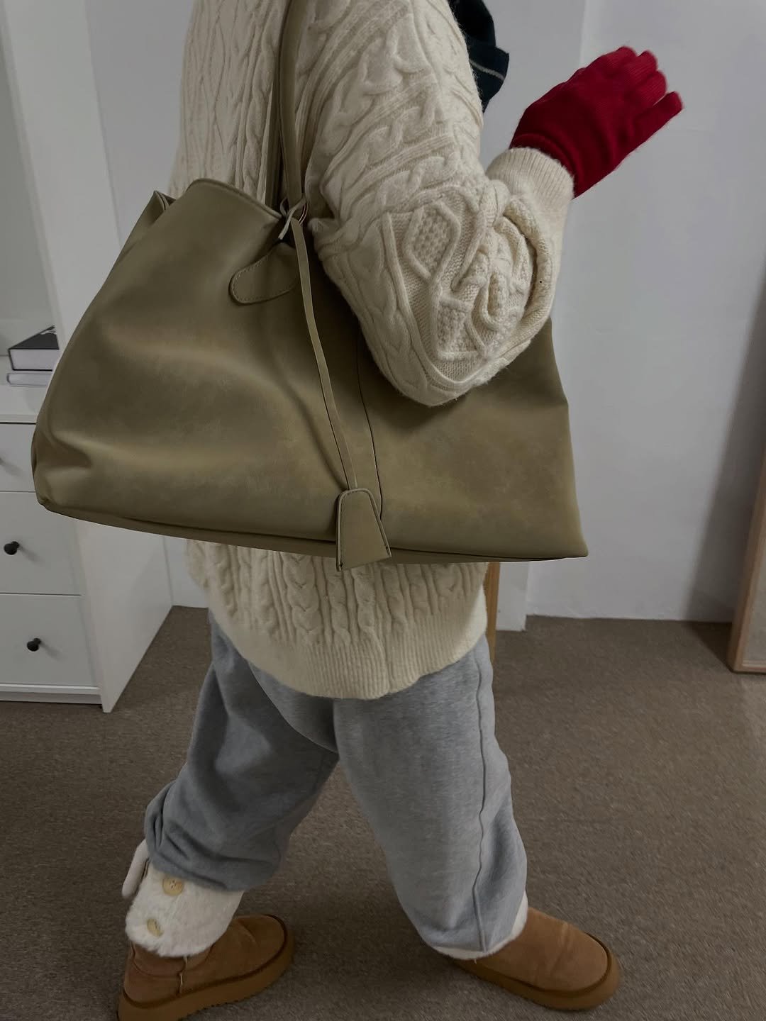 Photo by 김지선 on October 01, 2025. May be an image of 1 person, leather, tool bag, purse, sling, briefcase and text.