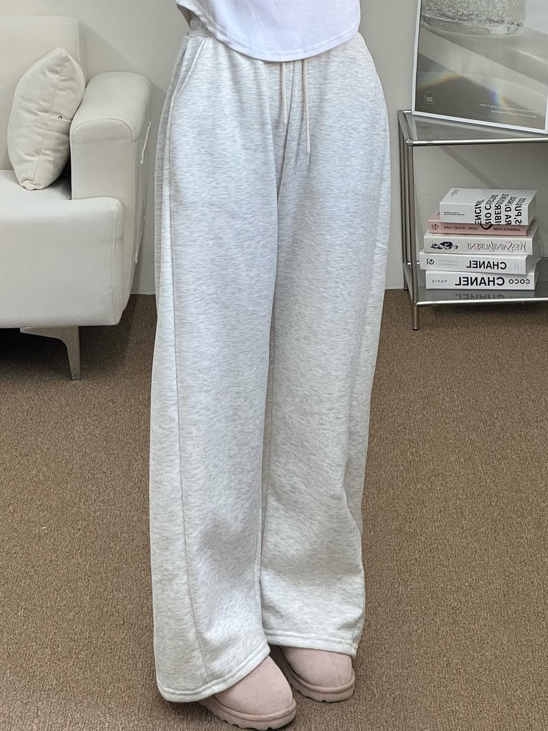 Photo by 김지선 on October 29, 2025. May be an image of sleepwear, sweatpants, sweatsuit, drawstring and text.