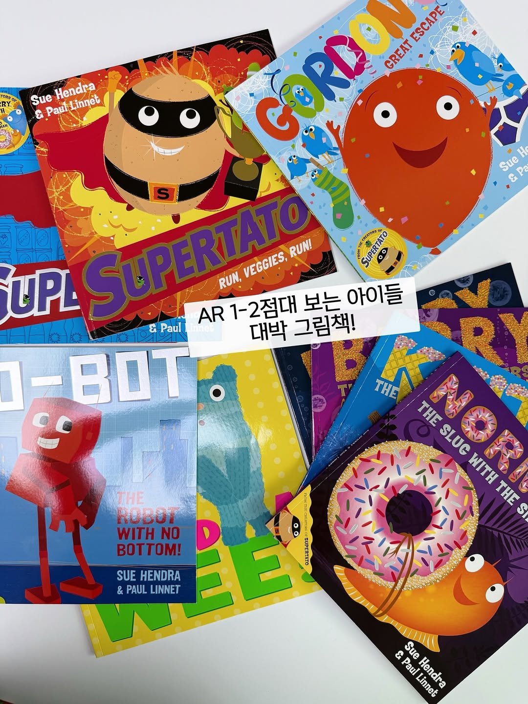 Photo by 책육아.엄마표영어 by 수수맘 김연주 on August 31, 2025. May be an image of Superman, mouse pad, book, lego, poster, card, magazine and text that says 'Sue Hendr & PautLinnet PaulL Sue ΑΡε H H GORCON ESCAPE ESCAPE GREAT Oe UPL VEGGIES, SUPERTATO RUN! SUPERTATO SUPERTAT RUN, AR 1-2점대 보는 아이들 & Paul 대박 그림책! 1-BOT. AN THE ROBOT WITHNO BOTTOM! THE THE SLUG WITH THE $I 00 2드나대이시 DERM4のち SUE HENDRA & PAULLINNET PAUL LINNET & Sue Paul Linnet Hendra'.