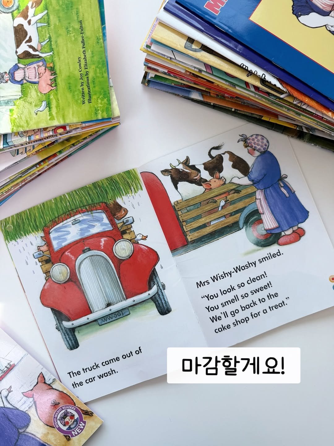 Photo by 책육아.엄마표영어 by 수수맘 김연주 on January 13, 2026. May be an illustration of card, book and text that says '. Falton Fller- Cowler Hiz WrittenbyJoy lustrationsby monan smiled. Mrs "Υου smell back look Wishy-Washy so clean! so sweet! the You We'l 'Il go cake shop for α treat.' 天統 The truck came out of the car wash. 2 마감할게요! NEW'.