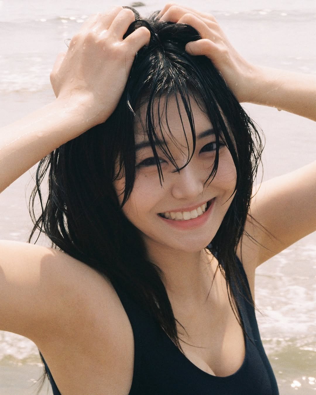 Photo shared by 🏮 珊瑚 SANGO 🏮 on May 31, 2025 tagging @2fyou_. May be an image of 1 person, hair, bra, beach and text.