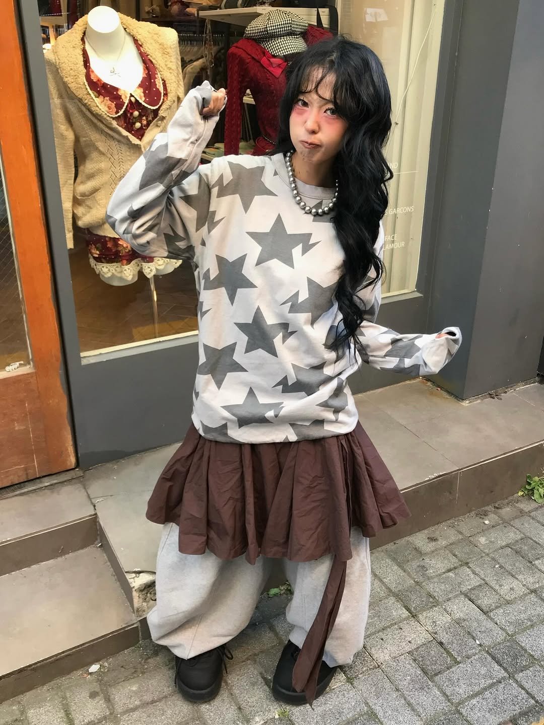 Photo shared by 스윙잉서울 대구 on December 03, 2025 tagging @bape_japan. May be an image of costume, cloak, mannequin, kilt and text.