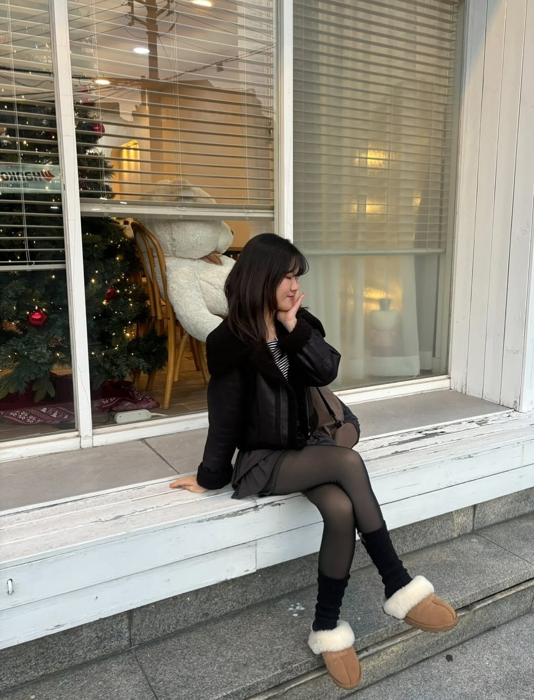 Photo by 세영 on January 20, 2026. May be an image of duffle coat, parka, boots, tights and text.