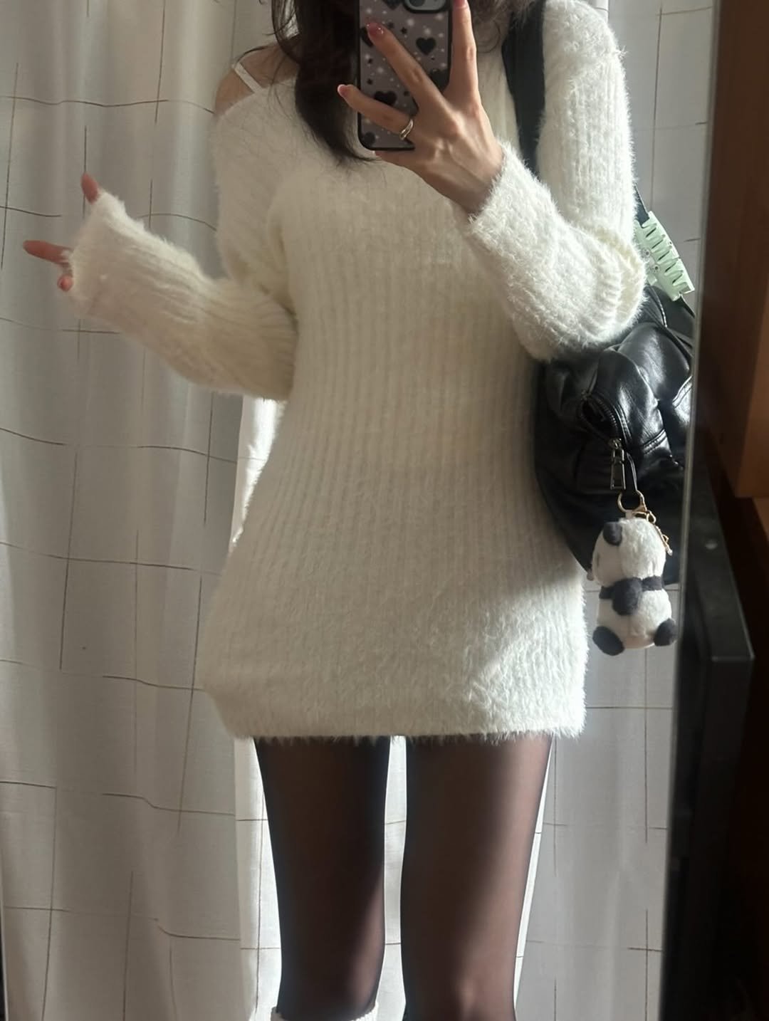 Photo by 세영 on February 17, 2026. May be an image of tights, miniskirt, turtleneck and text.