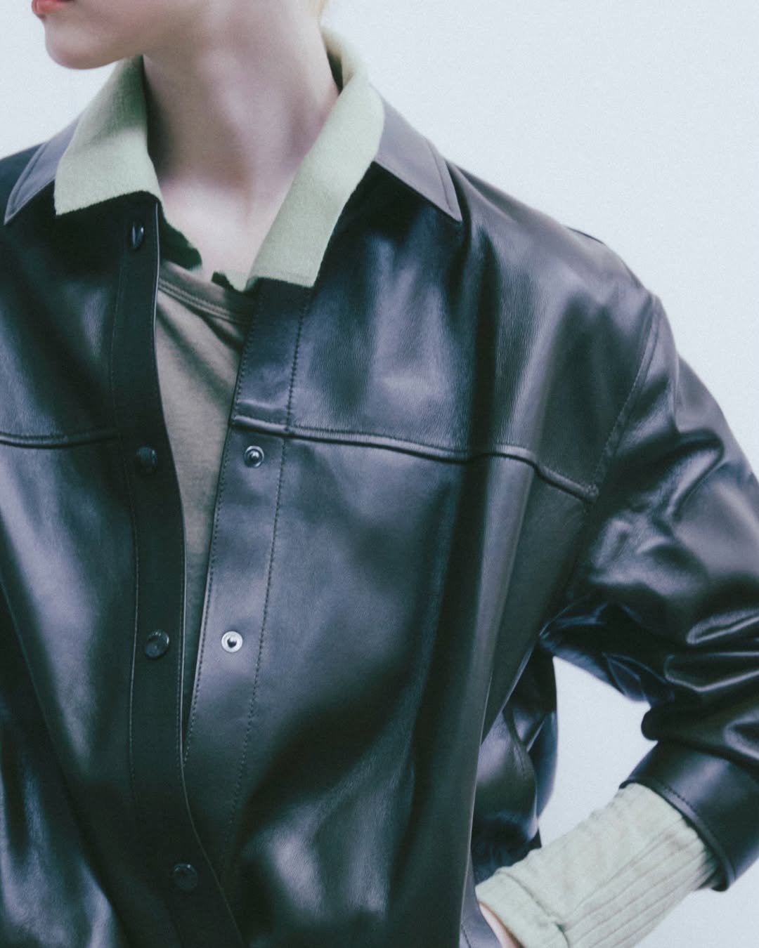 Photo by SYSTEM, SYSTEM HOMME on September 04, 2025. May be an image of 1 person, leather, jacket and text.