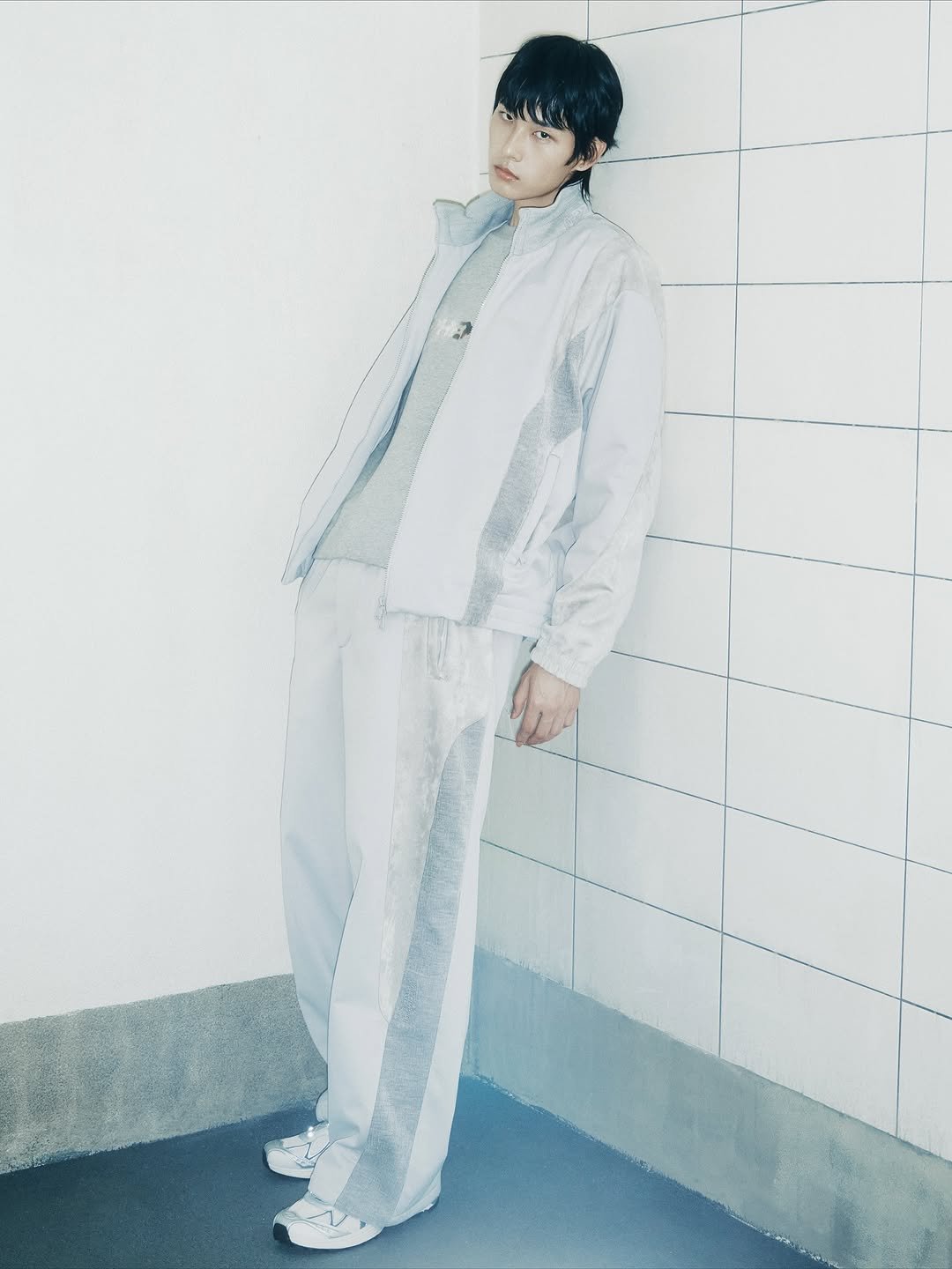 Photo by SYSTEM, SYSTEM HOMME on October 24, 2025. May be an image of one or more people, bangs, bolo tie and text.