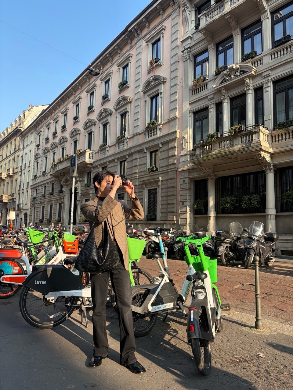 Photo by Lee Know on February 27, 2026. May be an image of one or more people, segway, bicycle, scooter, street, the Arno River and text.