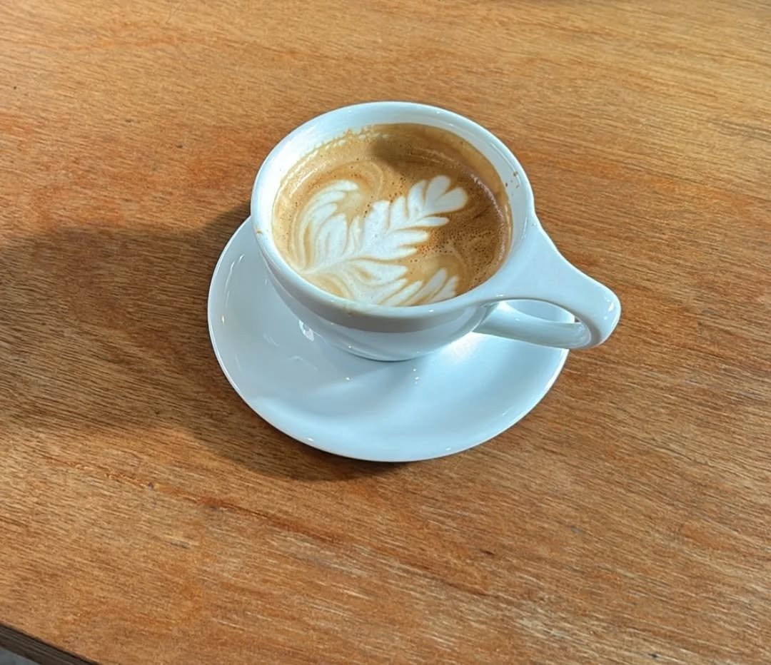 Photo by 혁이 on January 12, 2026. May be an image of coffee cup, coffee, cappuccino, cup and text.