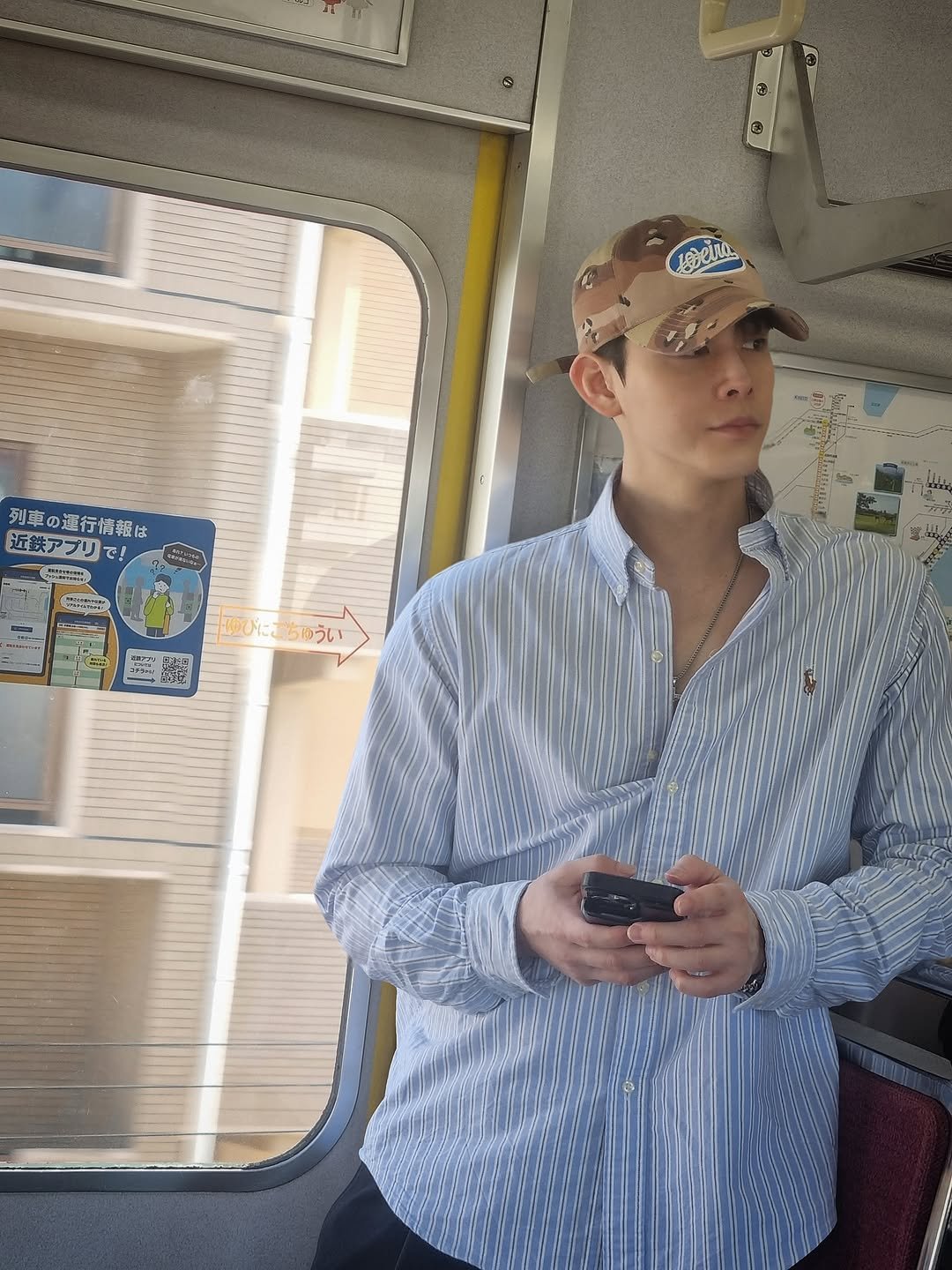 Photo by Theo Jang on April 22, 2026. May be an image of phone, train, hat, bus and text.