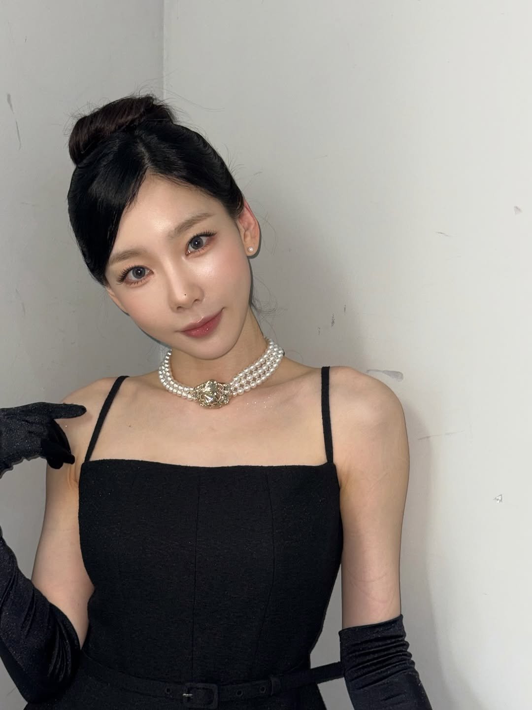 Photo by TaeYeon on October 04, 2025. May be an image of 1 person, makeup, hair, dress and text.