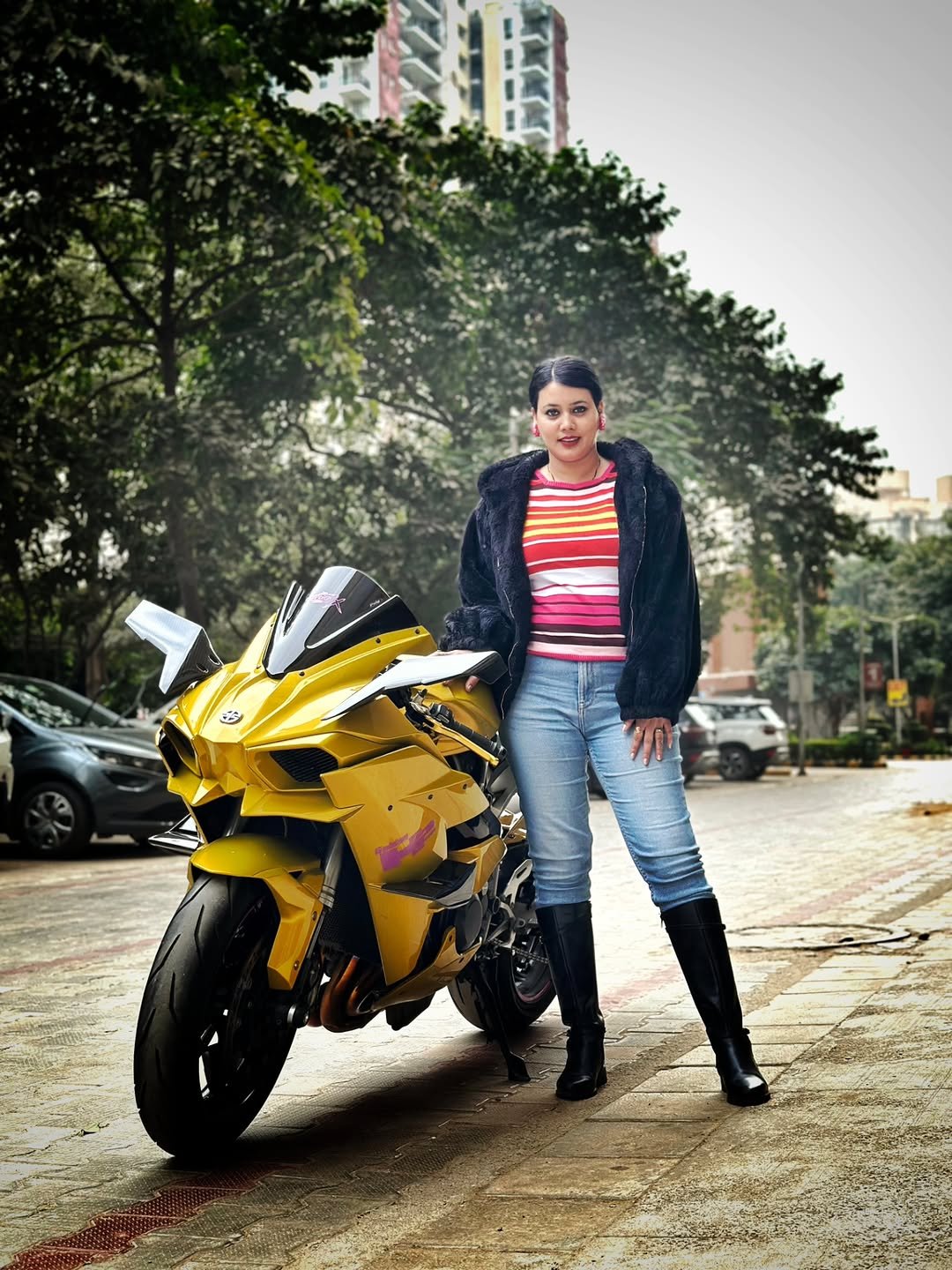 Photo by Tamanna_euphoria13 on January 06, 2026. May be an image of motorcycle, helmet, boots, scooter, road and text.