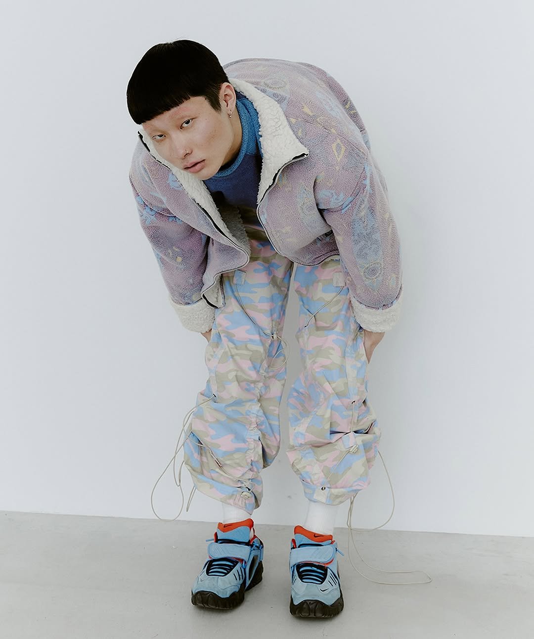 Photo shared by TAMF MGMT on August 14, 2025 tagging @5x3est15, and @tamf.mgmt. May be an image of 1 person, duffle coat, parka, turtleneck, sportswear and text.