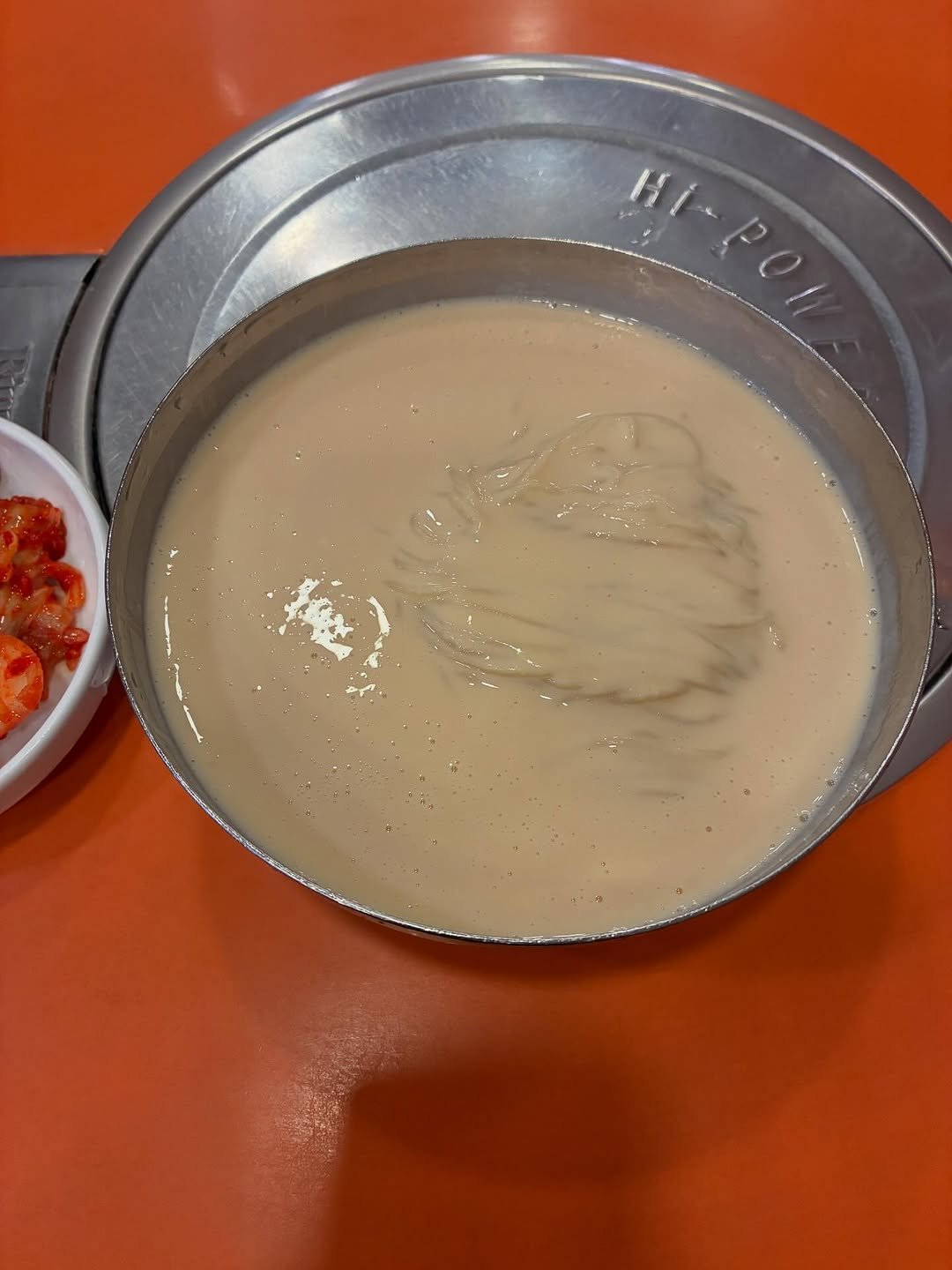 Photo by The Book Society on August 13, 2025. May be an image of fondue, congee, sauce and text.