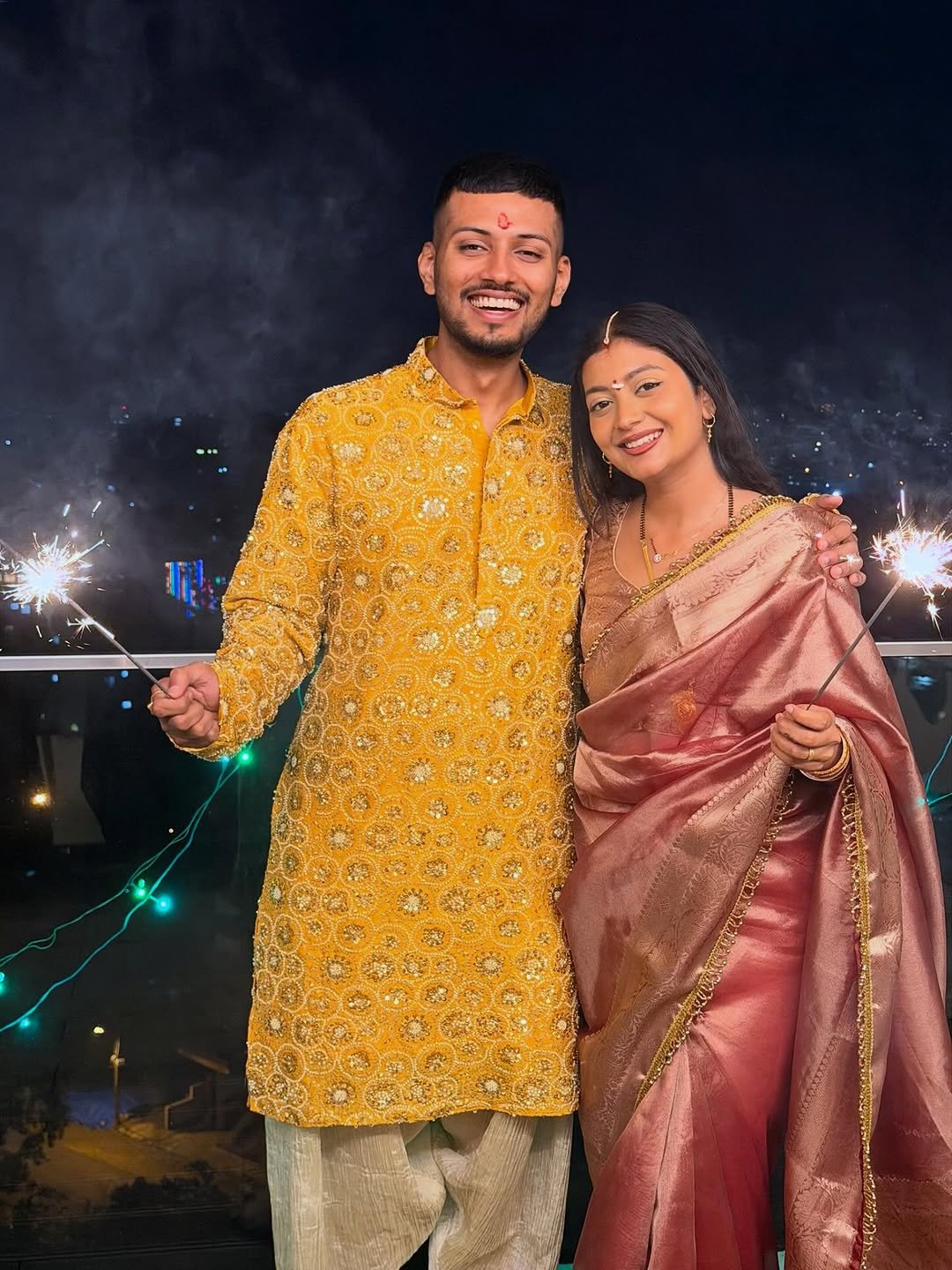 Photo by TechBurner on October 21, 2025. May be an image of one or more people, henna, sparkler, fireworks and text.