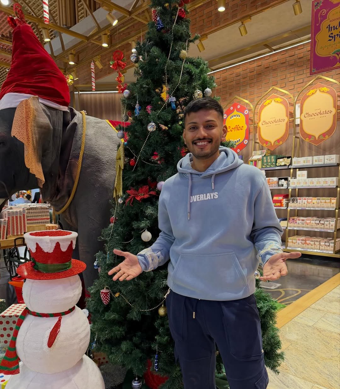 Photo by TechBurner on December 25, 2025. May be an image of christmas tree, gingerbread cookie, snowman, sweatpants and text.