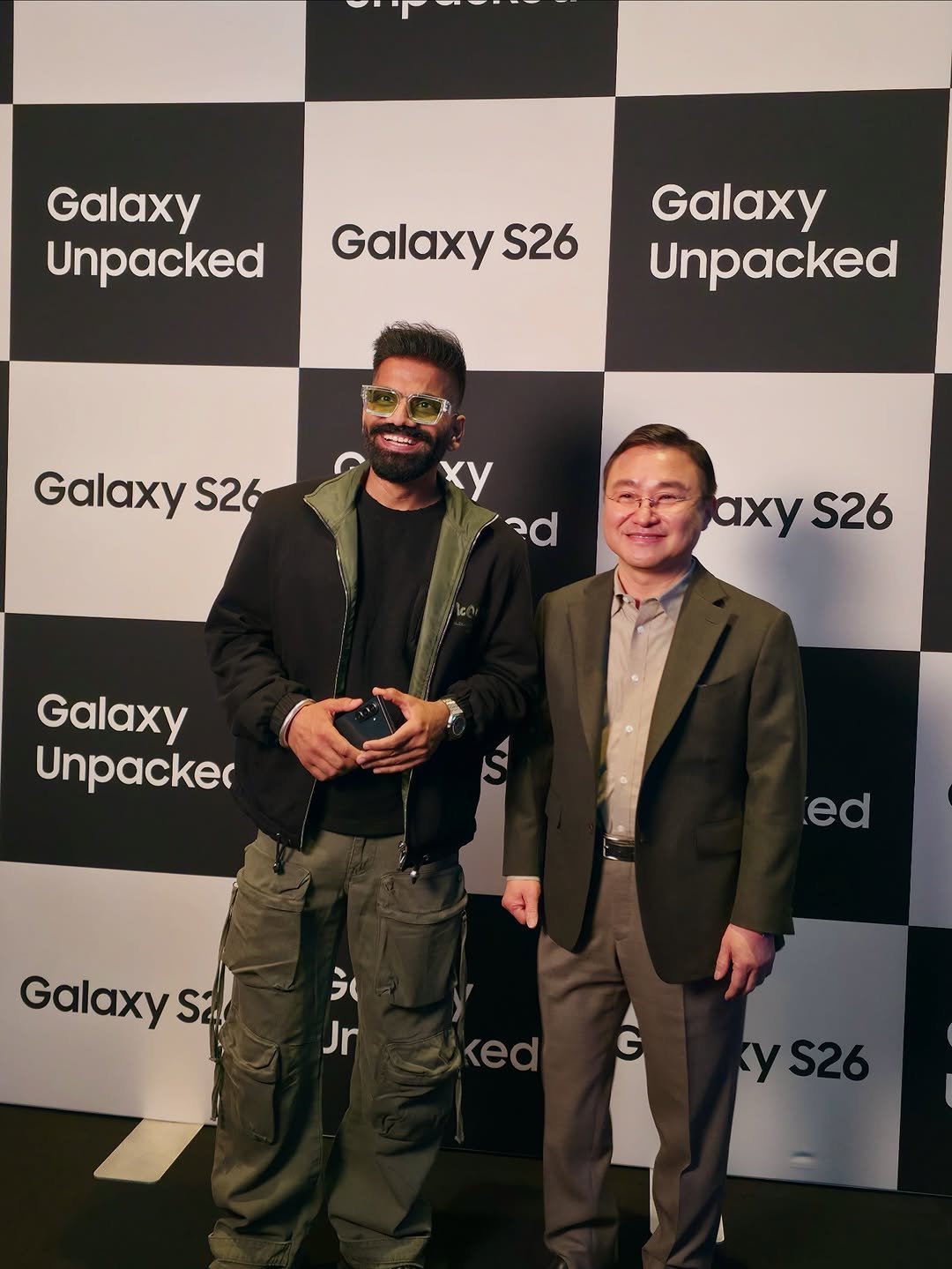 Photo shared by Gaurav Chaudhary on February 28, 2026 tagging @samsungmobile, @samsungwithgalaxy, and @samsungindia. May be an image of standing, screen, carpet and text that says 'Galaxy Unpacked Galaxy S26 Galaxy Unpacked Galaxy S26 xy ad axy axyS26 S26 Galaxy Unpacker ed Galaxy S2 え Jr G'.