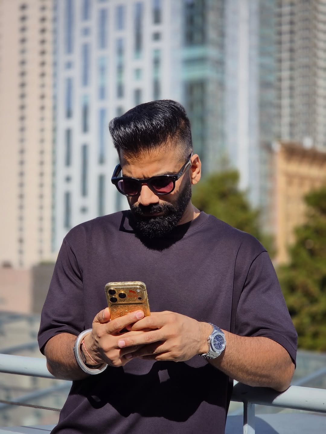 Photo by Gaurav Chaudhary on February 24, 2026. May be an image of one or more people, beard, wrist watch, phone, sunglasses and text.