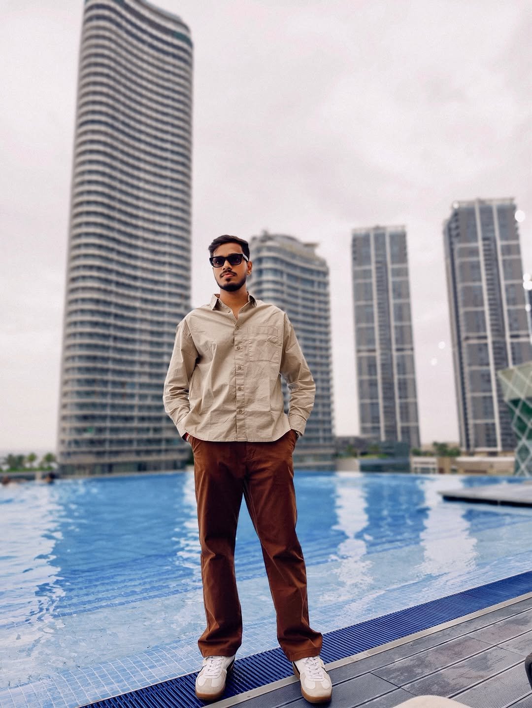 Photo shared by Yogesh Kawle on January 12, 2026 tagging @yogeshtechworld. May be an image of pool, skyscraper and text.