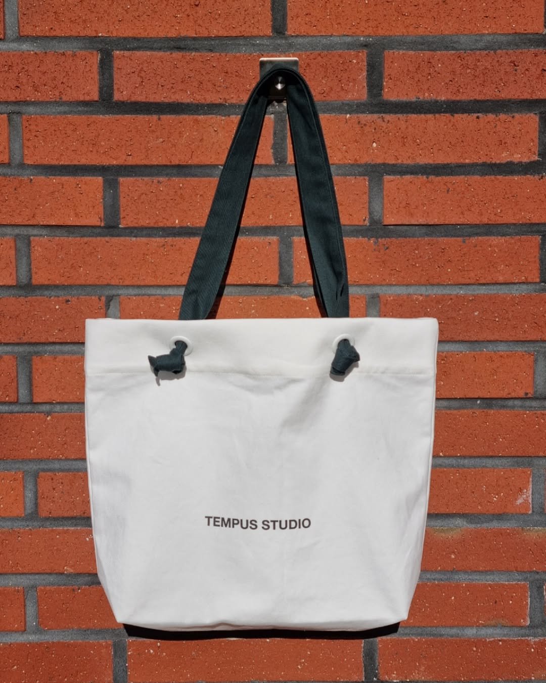 Photo by TEMPUS STUDIO on November 04, 2025. May be an image of tool bag, grocery bag, pouch, brick wall and text that says 'TEMPUS TEMPUSSTUDIO STUDIO'.