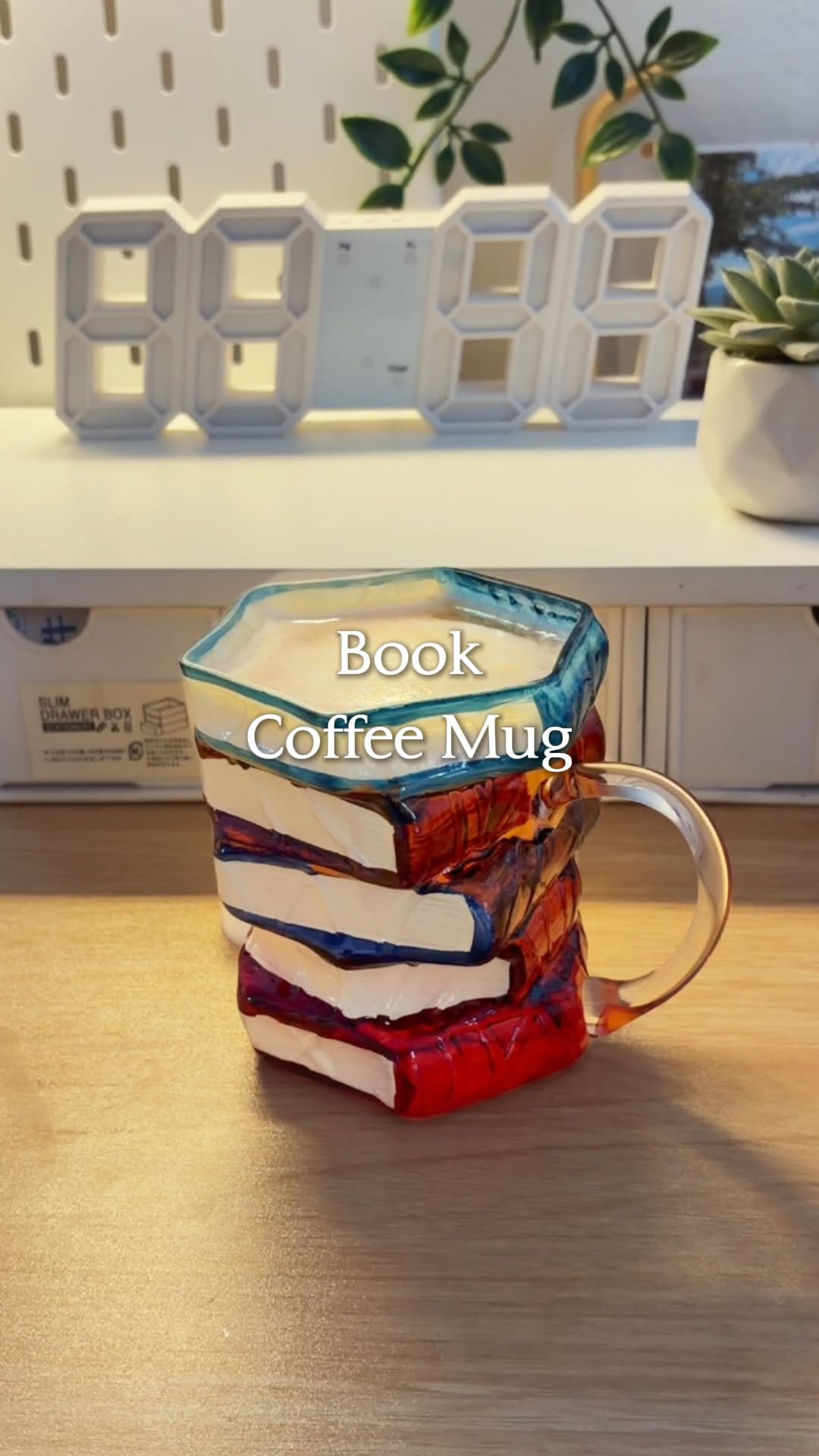 temu 게시물 이미지: A creative glass mug shaped like stacked books...