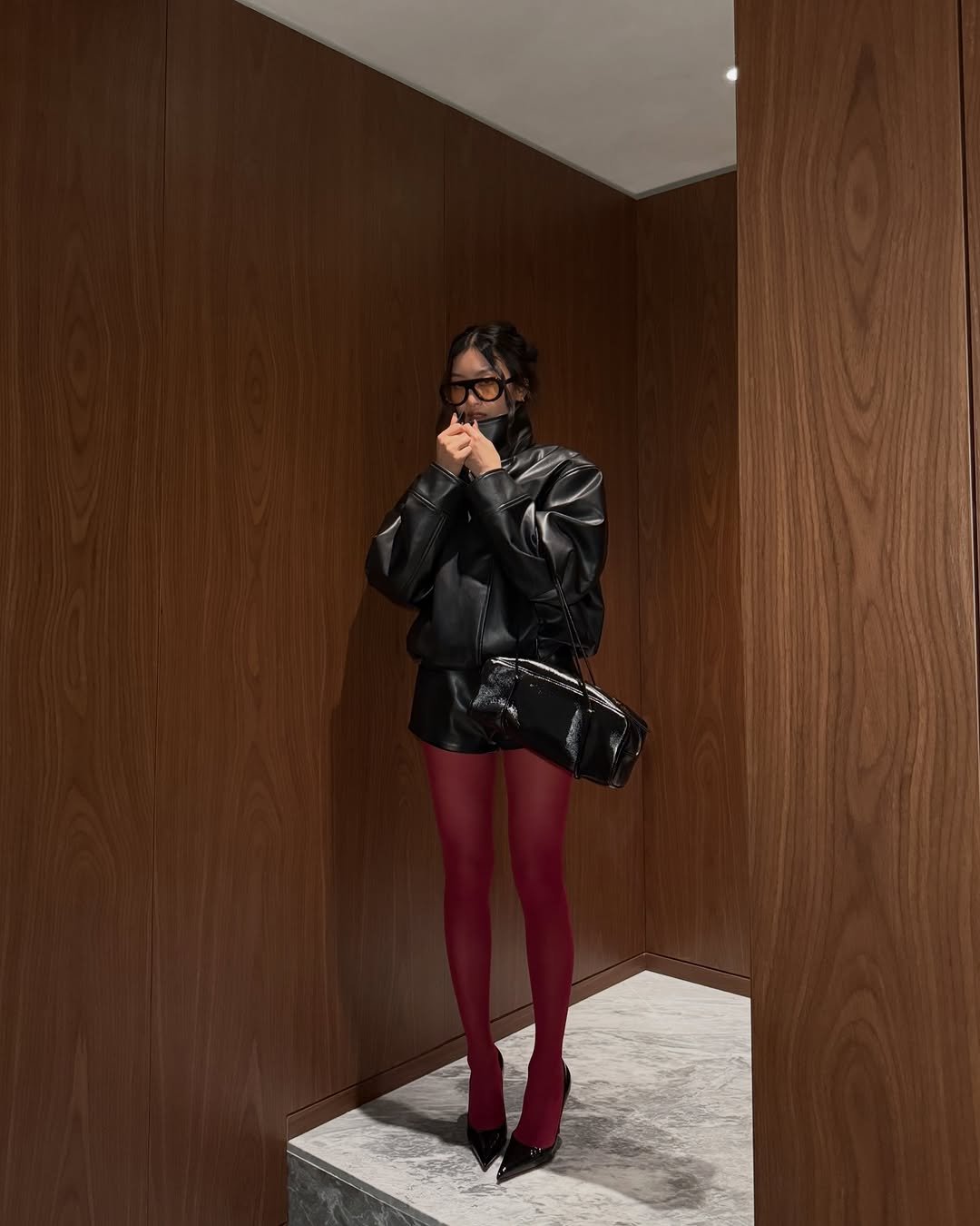 Photo by Thanya Wong on March 21, 2026. May be an image of leather, miniskirt, tights and text.