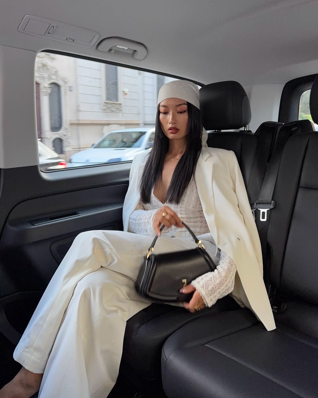 Photo by Thanya Wong on September 25, 2025. May be an image of 1 person, car, blazer, beret, headscarf, turban and text.
