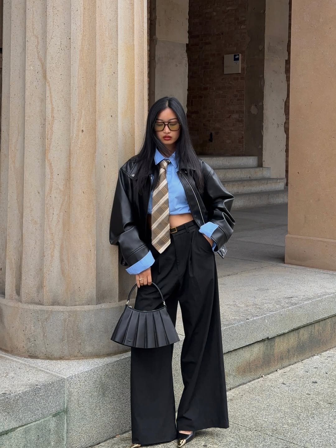 Photo by Thanya Wong on August 05, 2025. May be an image of 1 person, overcoat, blazer, jacket, turtleneck and text.
