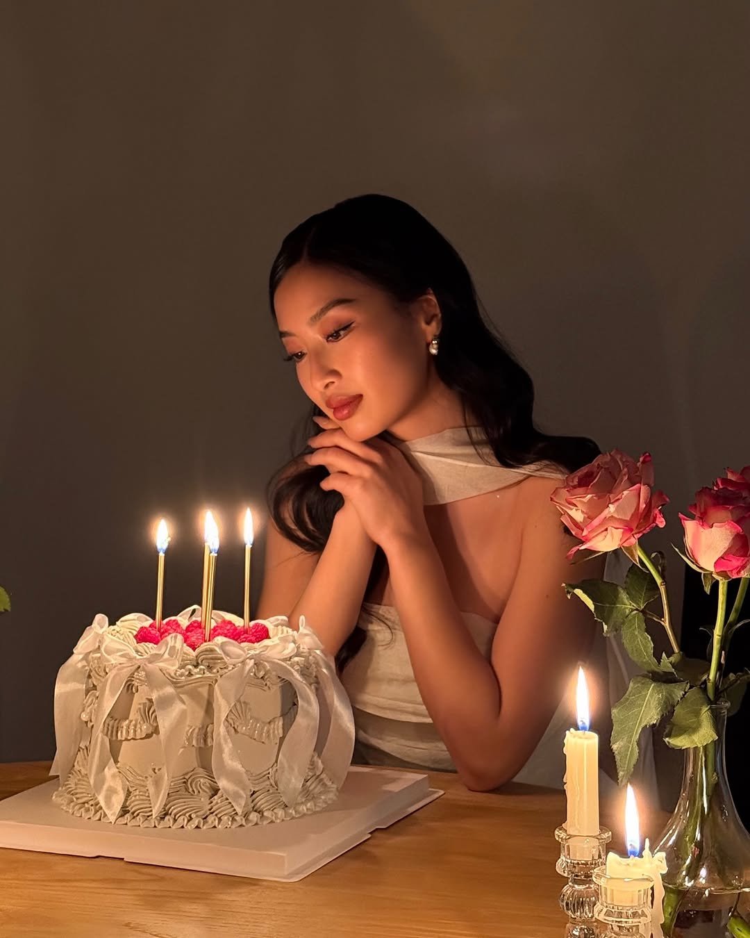 Photo by Thanya Wong on December 25, 2025. May be an image of one or more people, makeup, candle holder, cake, candle, prairie gentian and text.