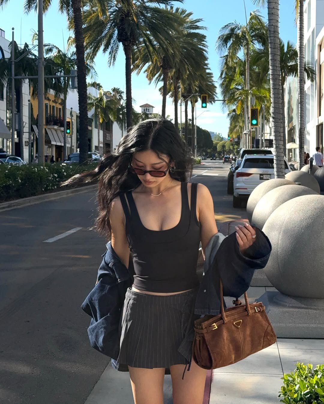 Photo by Thanya Wong on April 16, 2026. May be an image of miniskirt, palm trees and text.