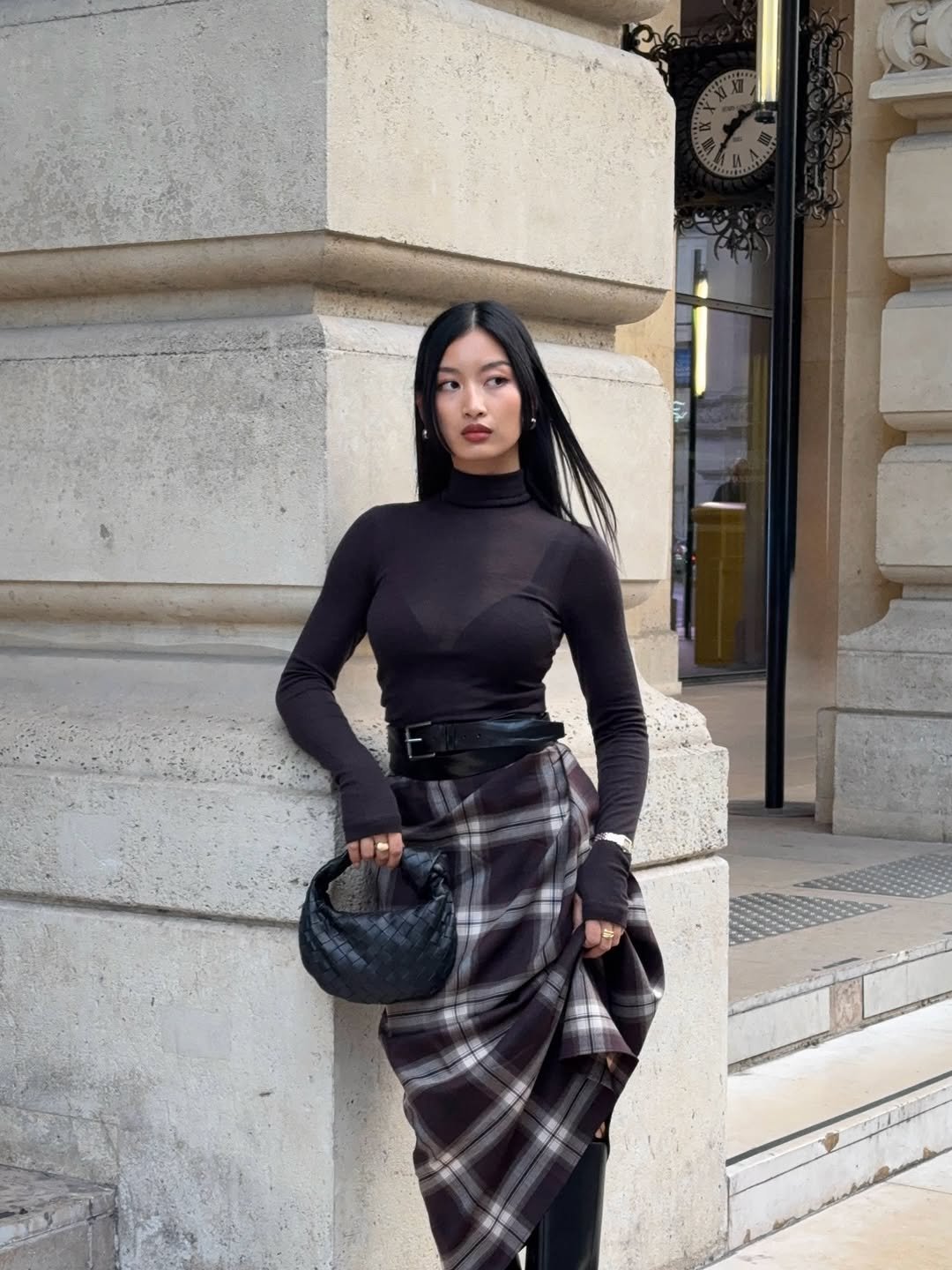 Photo by Thanya Wong on September 29, 2025. May be an image of 1 person, turtleneck, kilt, miniskirt and text.