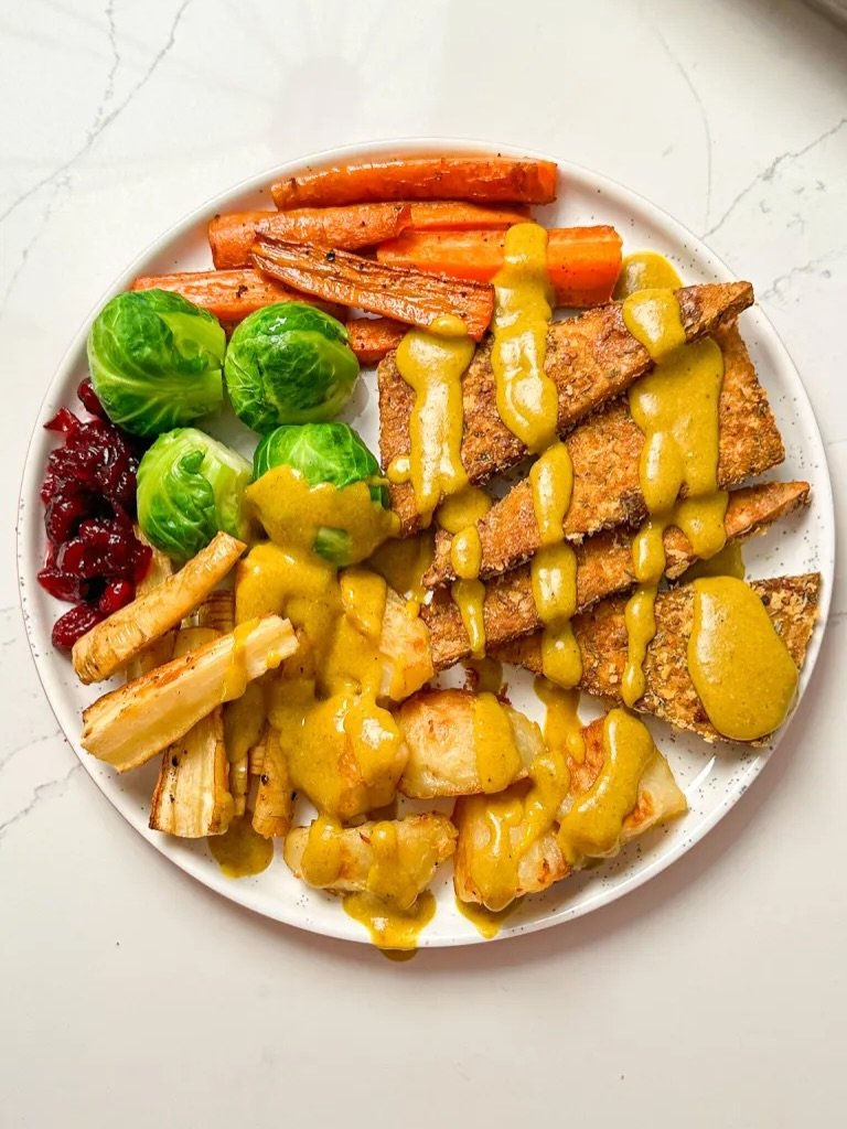 Photo by Stephanie De Angelis on November 26, 2025. May be an image of sauce, carrot, brussels sprouts and text.