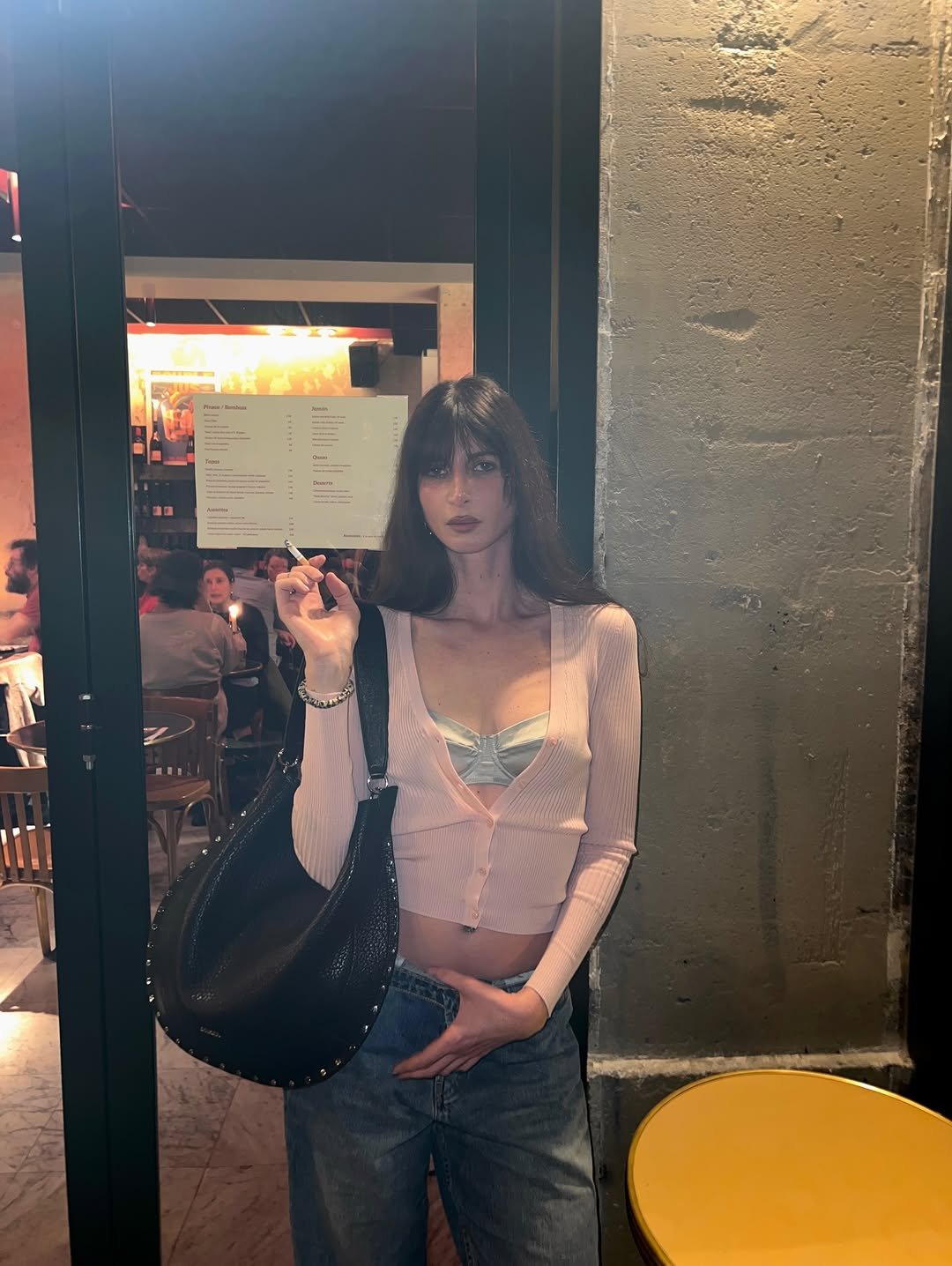 Photo shared by Laberiane Ponton on January 15, 2026 tagging @isabelmarant, @zodiaquestudios, and @saintartnewyork. May be an image of fishnet stockings, bra, top, cigarette and text.