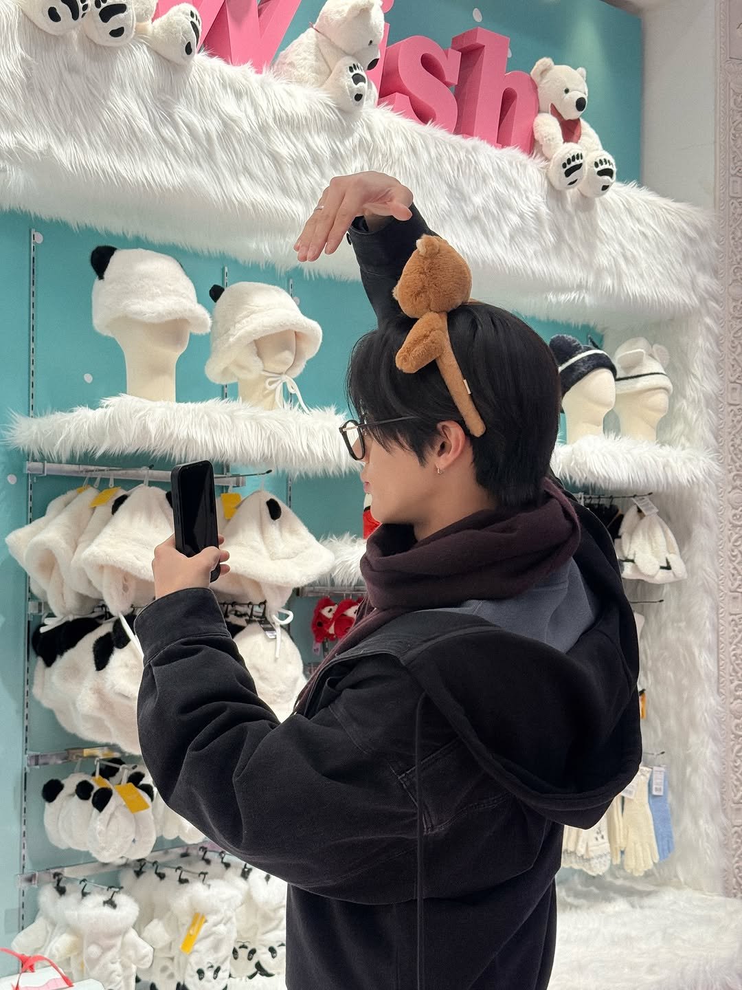 Photo shared by 더보이즈 (THE BOYZ) on December 22, 2025 tagging @eric.is.youngjae. May be an image of penguin, duffle coat, toy, snowman and text that says 'Shi'.