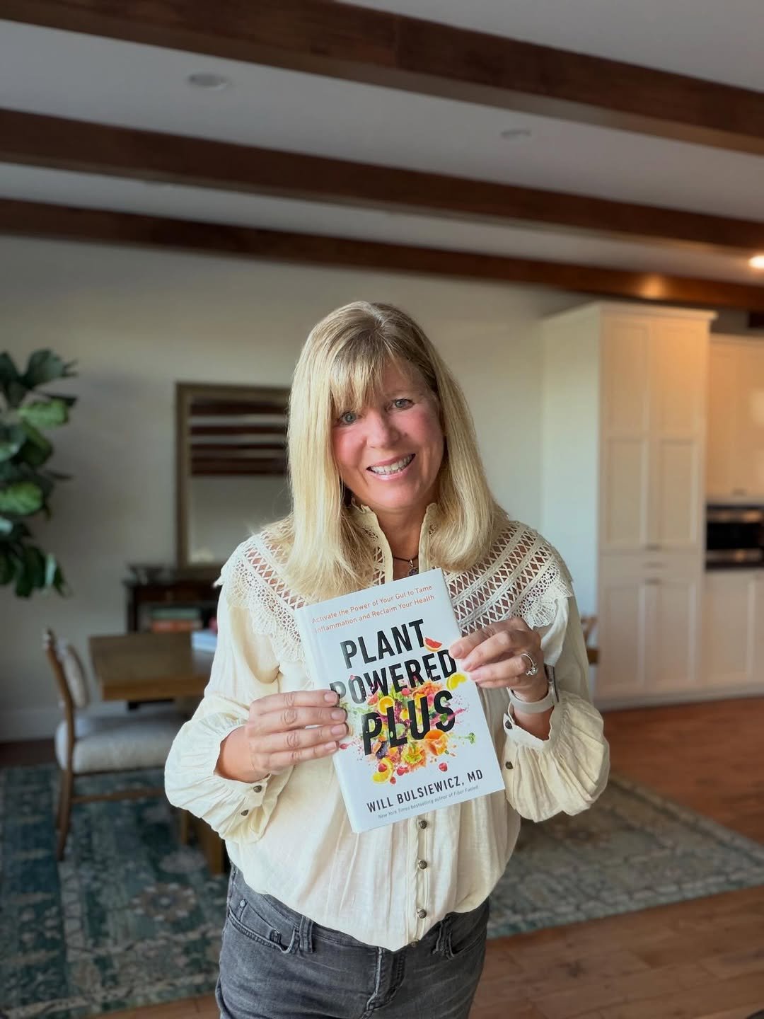 Photo shared by EA Stewart, RD | Gut Health Nutritionist on January 13, 2026 tagging @theguthealthmd. May be an image of one or more people, people smiling, book, magazine and text.