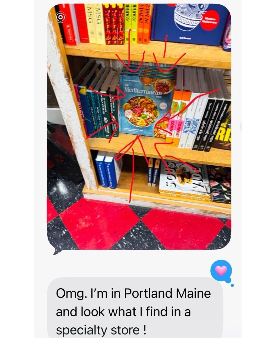 A text message from a friend highlighting The Mediterranean Dish Cookbook at a local bookstore