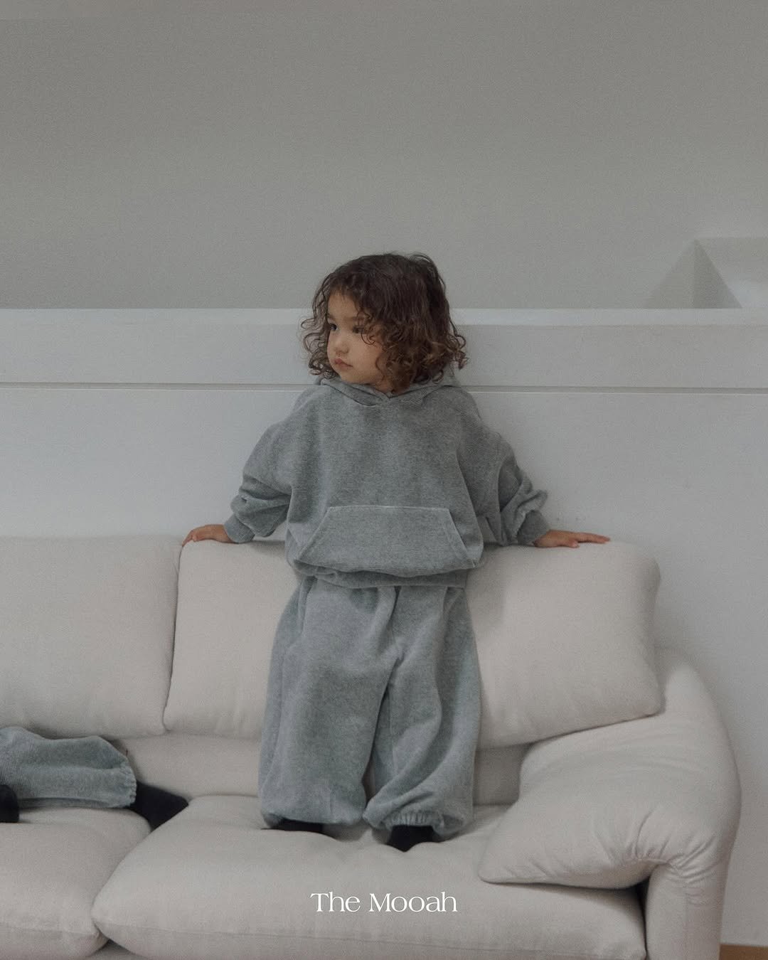 Photo by The Mooah on September 15, 2025. May be an image of 1 person, child, sleepwear, drawstring, sweatsuit, sweatshirt, sweatpants and text that says 'The Mooah'.