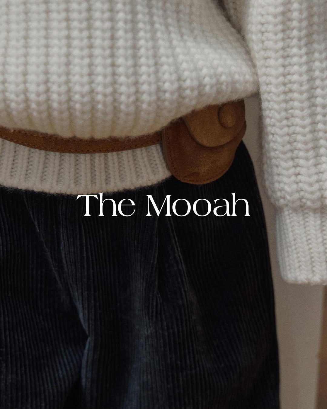 Photo by The Mooah on October 15, 2025. May be an image of duffle coat, knit, turtleneck, belt buckle, belt and text that says 'The Mooah'.