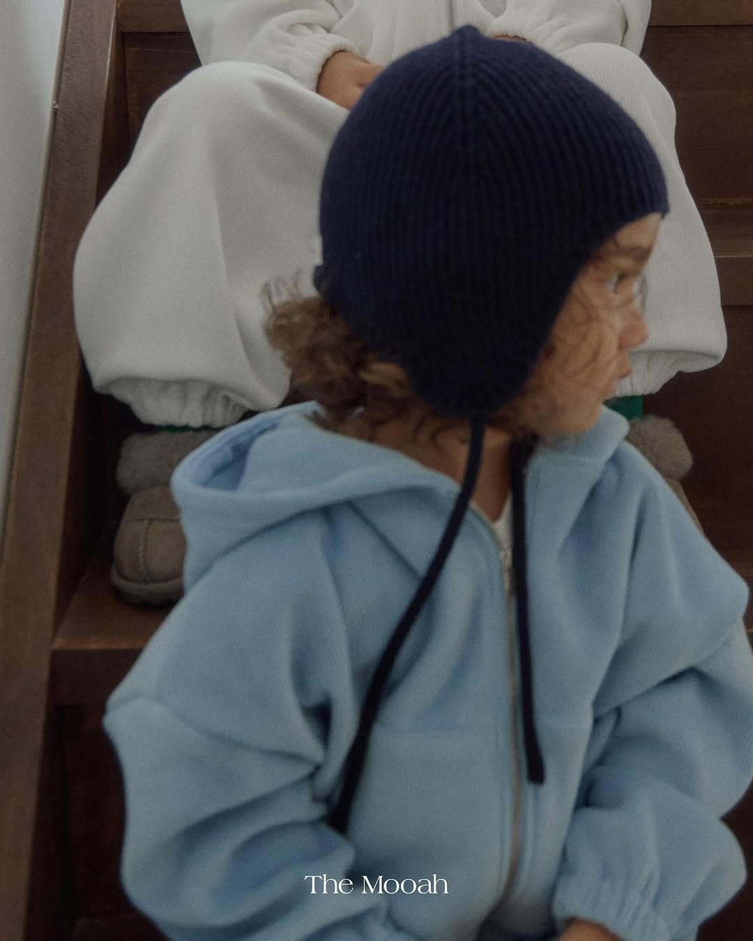 Photo by The Mooah on October 15, 2025. May be an image of child, duffle coat, hat, head covering, beret and text.