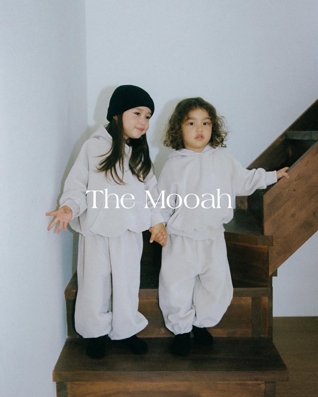 Photo by The Mooah on September 15, 2025. May be an image of 2 people, child, duffle coat, magazine, beret, turtleneck, sweatpants, sweatsuit and text that says 'The Mooah'.