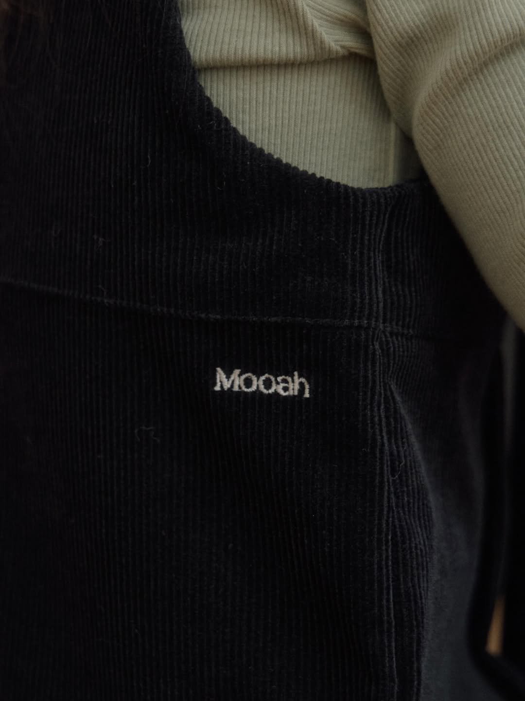 Photo by The Mooah on December 17, 2025. May be an image of vest, turtleneck and text that says 'Mooah'.