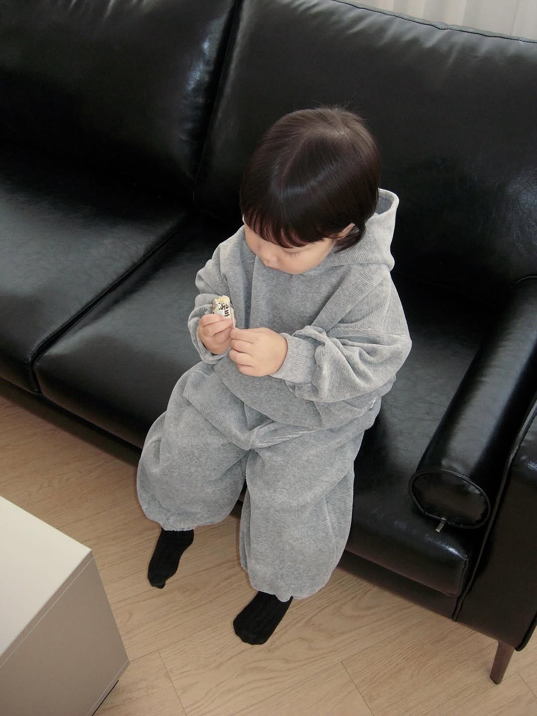 Photo by The Mooah on September 17, 2025. May be an image of 1 person, baby, sleepwear, duffle coat, bath robe, robe, sweatsuit and text.