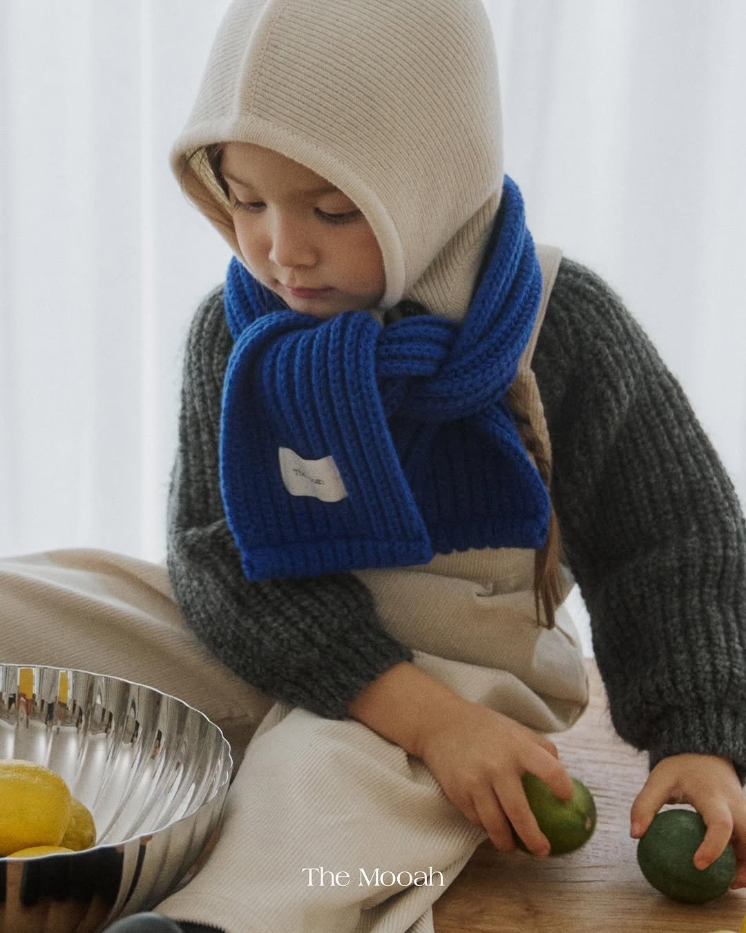 Photo by The Mooah on November 03, 2025. May be an image of baby, duffle coat, scarf, hat, face mask, knit and text that says 'The Mooah'.