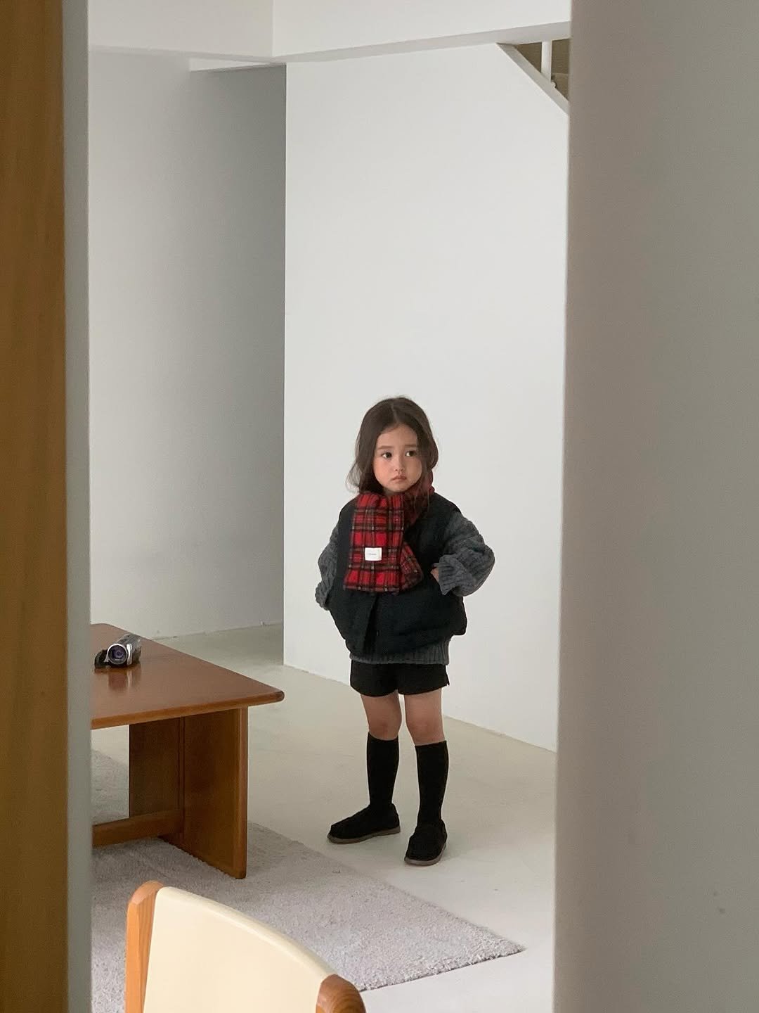 Photo by The Mooah on September 14, 2025. May be an image of 1 person, child, standing, duffle coat and text.