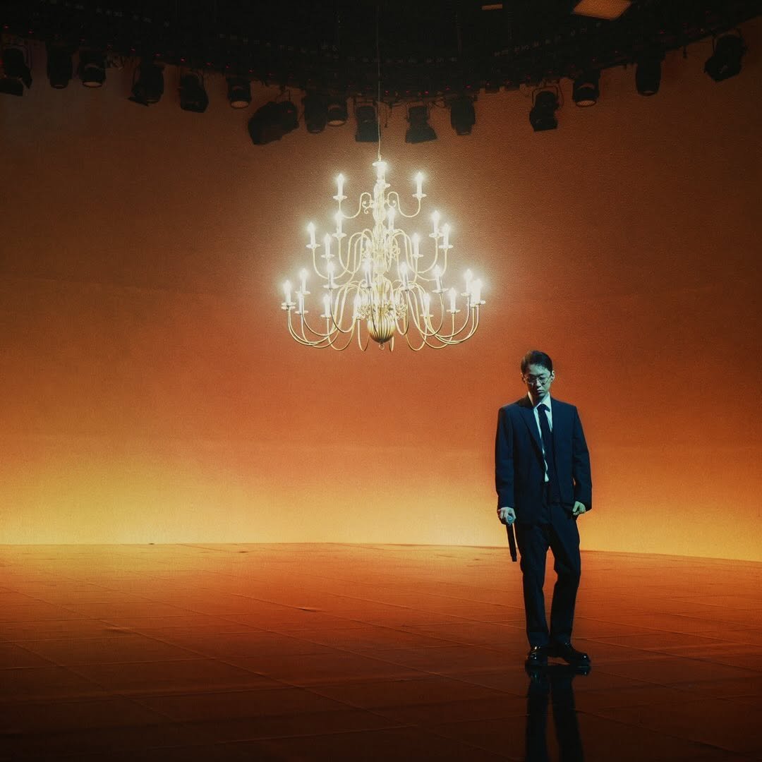 Photo by The Quiett on December 23, 2025. May be an image of candle holder, suit, chandelier and text.