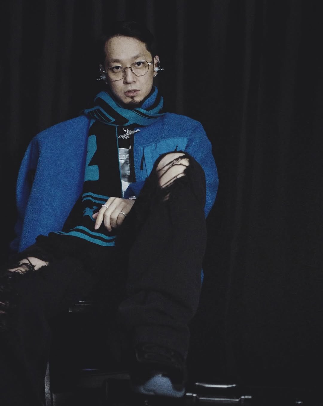 Photo by The Quiett on December 06, 2025. May be an image of one or more people, duffle coat, sweatpants, sweater, fleece, turtleneck and text.