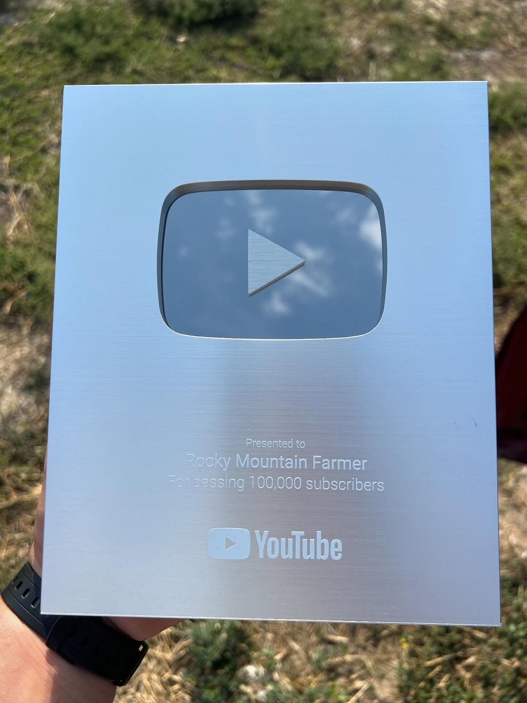 Photo by Tehren Likes on September 05, 2025. May be an image of clipboard, screen, tablet and text that says 'Presented to Rocky Mountain subsoribers Farmer For pessing 100,000 subscribers YouTube'.