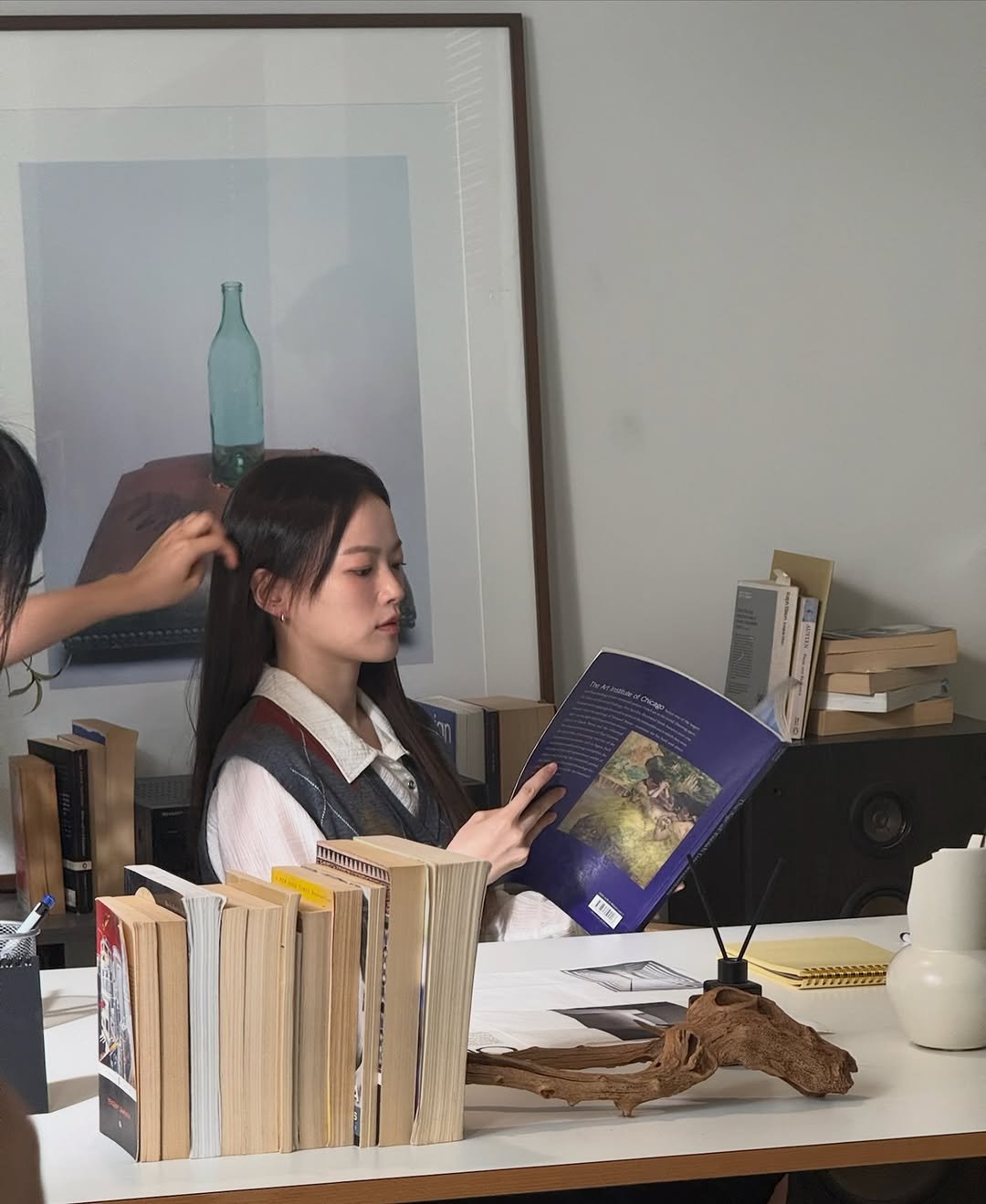 Photo shared by 천우희 on October 01, 2025 tagging @seouldanurim. May be an image of 2 people, braids, people studying, book and text.